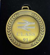 A commemorative gold award medal to 91101 Flying Scotsman BN