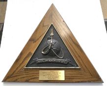 A wooden and metal wall plaque for the North Island Naval Air Rework Facility, from Captain Leo L