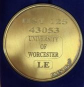 A commemorative gold award medallion to HST 125 43053 Univesity of Worcester LE