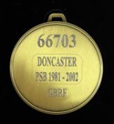A commemorative gold award medal to 66703 Doncaster PSB 1981-2002 GBRF