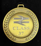 A commemorative gold award medal to 37603 British Steel Corby BN