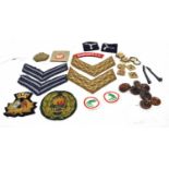 Quantity of 20th century cloth British military insignia to include chevrons, officers pips and