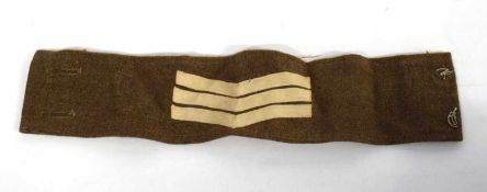 20th century British Army Sgt insignia armband upon battledress serge material (lacking buttons)