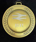 A commemorative gold award medal to 66767 Kings Cross PSB 1971-2021
