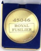 A commemorative gold award medallion to 55010 The Kings Own Scottish Borderer
