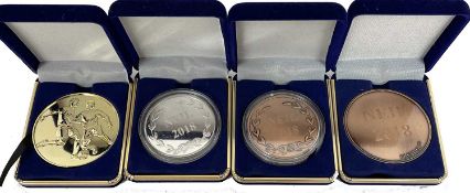 Mixed lot of bronze, silver and gold commemorative award medallions to Neil 2018
