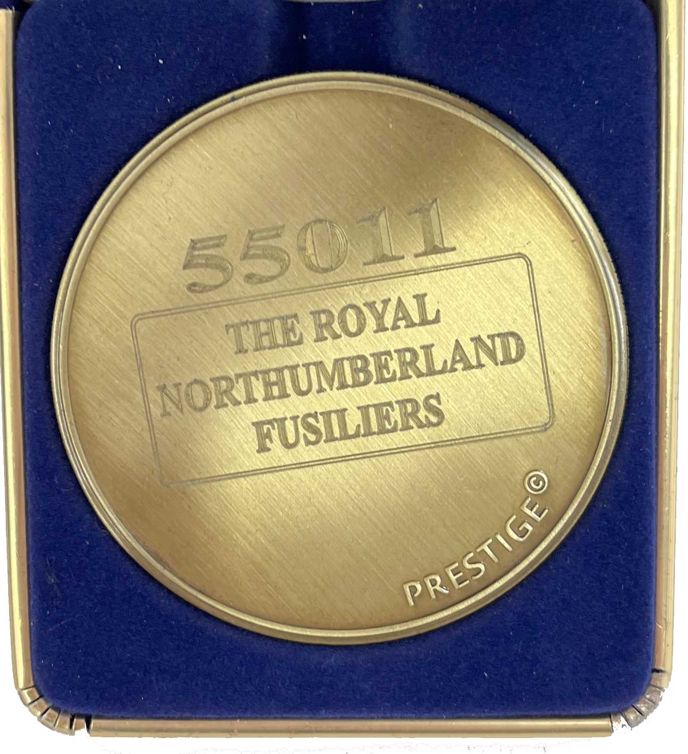 A commemorative gold award medallion to 55011 The Royal Northumberland