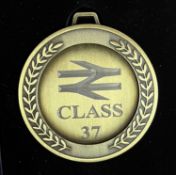 A commemorative gold award medal to 37023 Stratford TMB SF