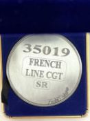 A commemorative silver award medallion to 35019 French Line CGT SR