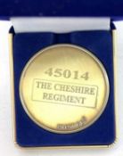 A commemorative gold award medallion to 45014 The Cheshire Regiment