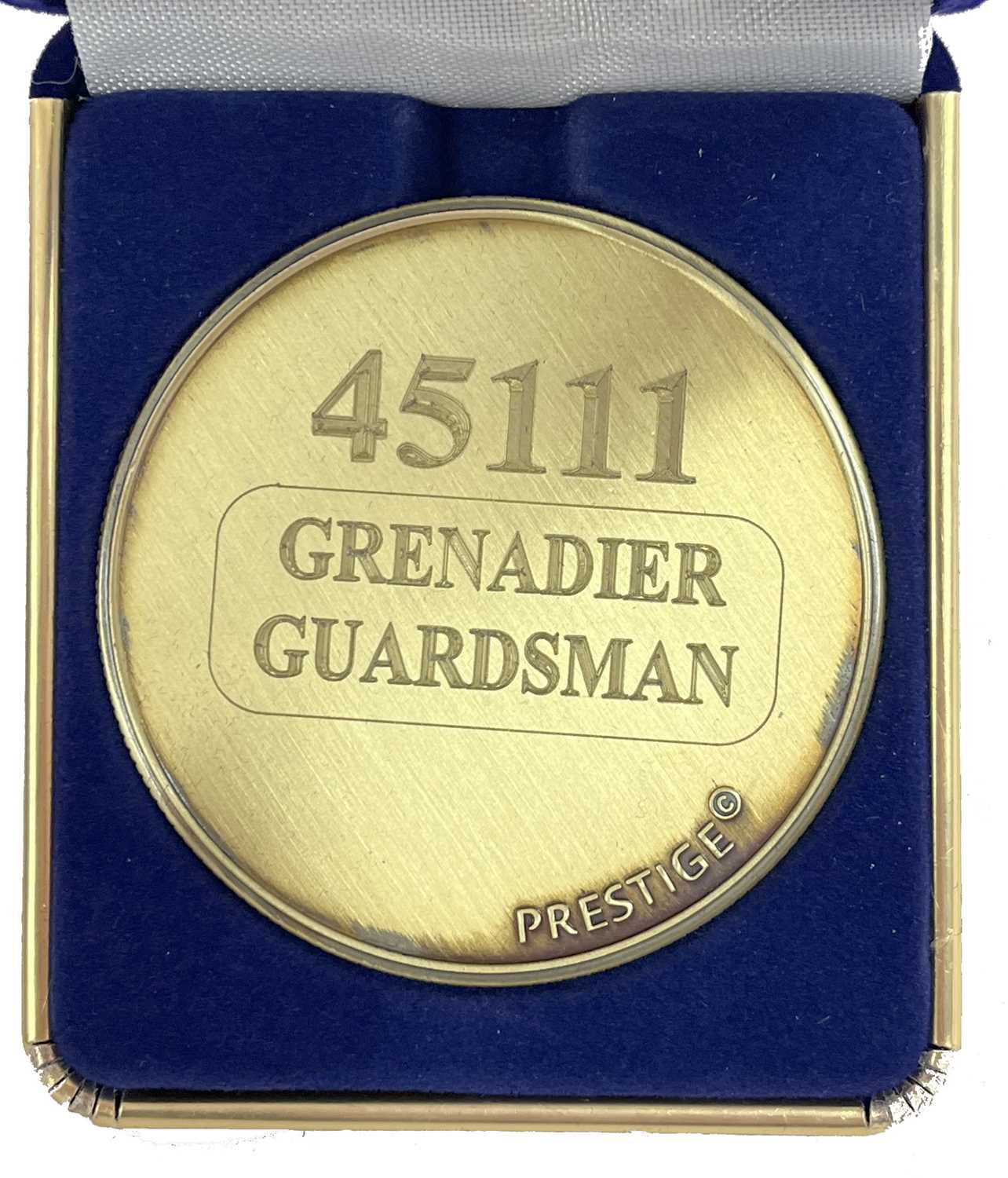 A commemorative gold award medallion to 45111 Grenadier Guardsman
