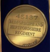 A commemorative gold award medallion to 45131 Bedfordshire and Hertfordshire Regiment
