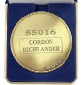 A commemorative gold award medallion to 55016 Gordon Highlander