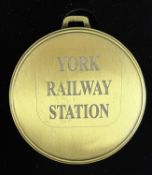 A commemorative gold award medal to York Railway Station