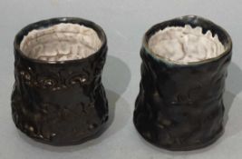Clare CLEMO (20th Century) Two earthenware black glazed Unomi, signed on labels to base, 3.5"