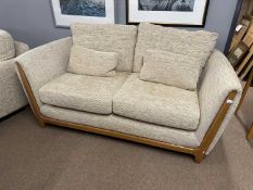 Ercol oatmeal upholstered three piece suite with accompanying foot stool