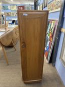 Ercol light elm narrow cupboard with internal CD racks, 35cm wide, 117cm high