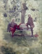 British photographic print, 'At Rowler 84', two women posing next to a fox along a bench,