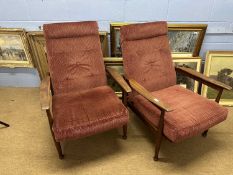 Pair of mid Century teak framed recliner armchairs with maroon upholstery by Guy Rogers