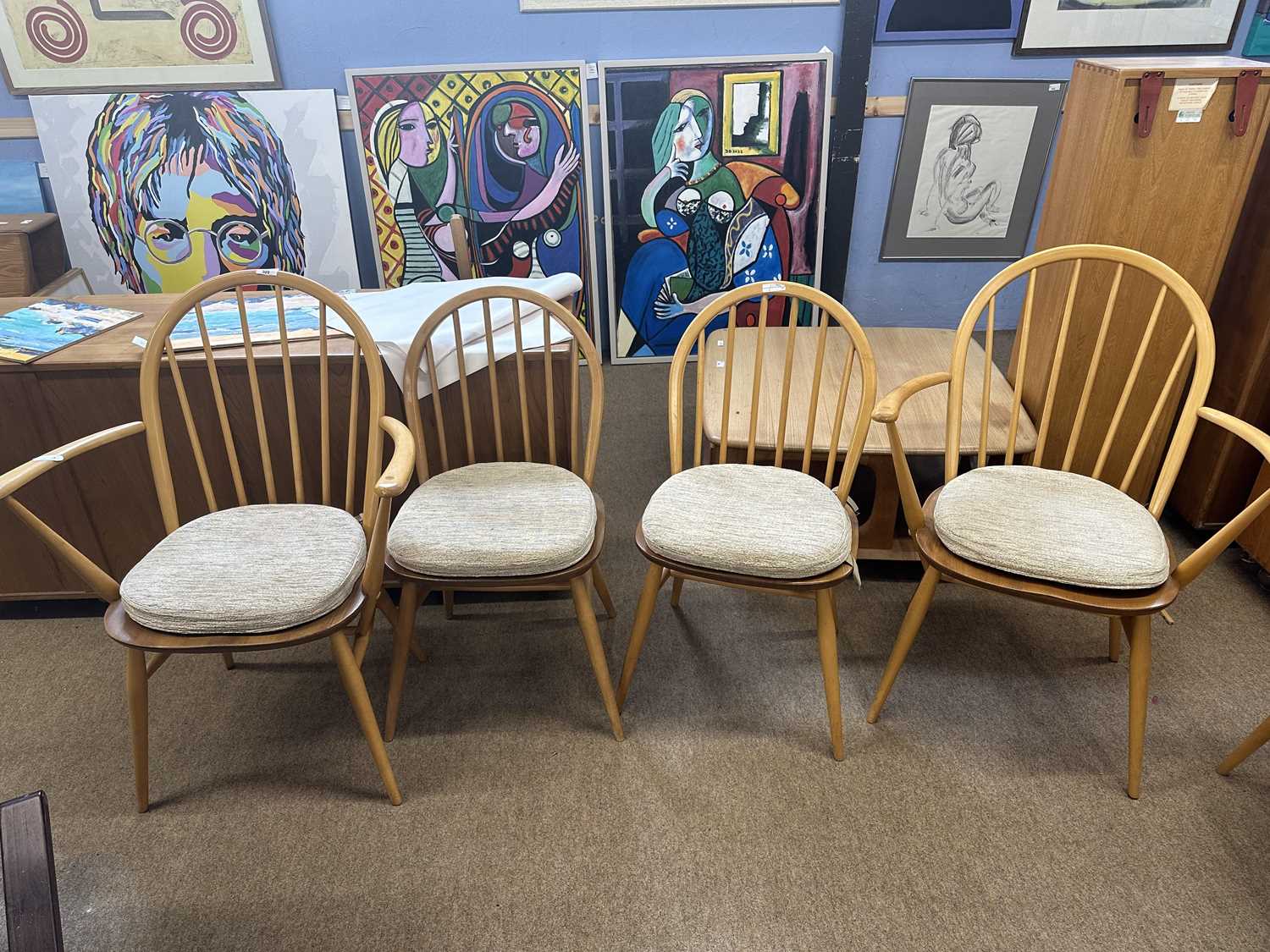 Set of four Ercol stick back dining chairs with oatmeal coloured seat pads