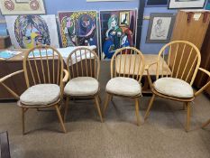 Set of four Ercol stick back dining chairs with oatmeal coloured seat pads