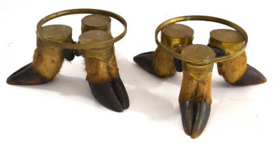 Two Victorian taxidermy deer hoof bowls/jardiniere stands, both consisting of three hooves and brass