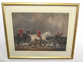A large 19th century fox hunting print of for gentlemen mounted on horseback with hounds in the
