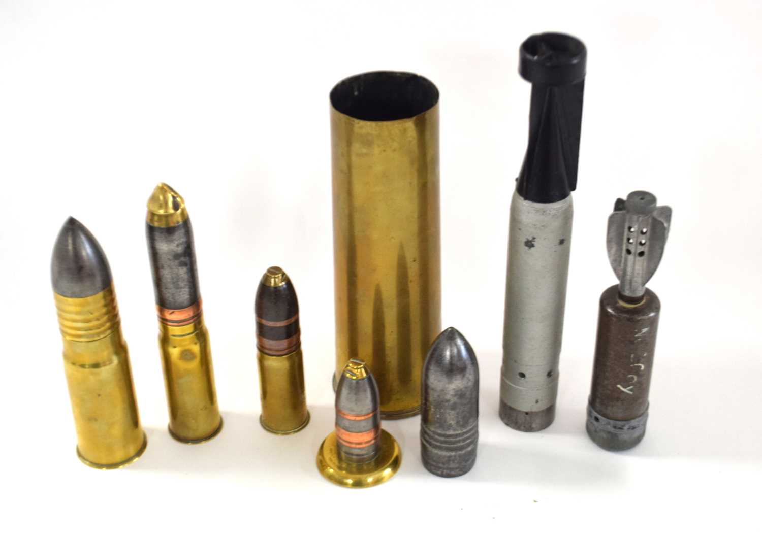 Quantity of eight shell casings, dummy rounds to include inert incendiary bomb, stoked mortar bomb