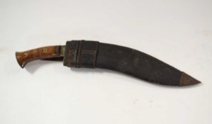 Good quality 20th Century military kukri with turned wooden handle and metal pommel with leather