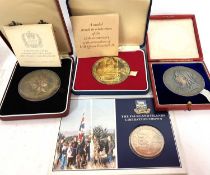 Two silver Queen Elizabeth II Silver Jubilee commerative medallions, together with a reproduction