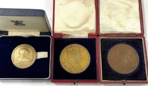 A cased Queen Victoria Diamond Jubilee commemorative medallion, an Edward VII Coronation commerative