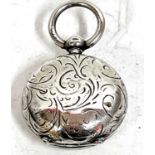 Hallmarked silver sovereign case of circular form, engraved all over with a foliate design (unable