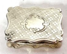 A Victorian silver vinaigrette of typical form with wavy edges, engine-turned decoration around a