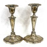 Pair of Edwardian silver candlesticks, plain oval form with reeded edges, oval tapering stems to