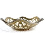 Edwardian silver shallow dish of pierced hexagonal form, the edge applied with a continuous