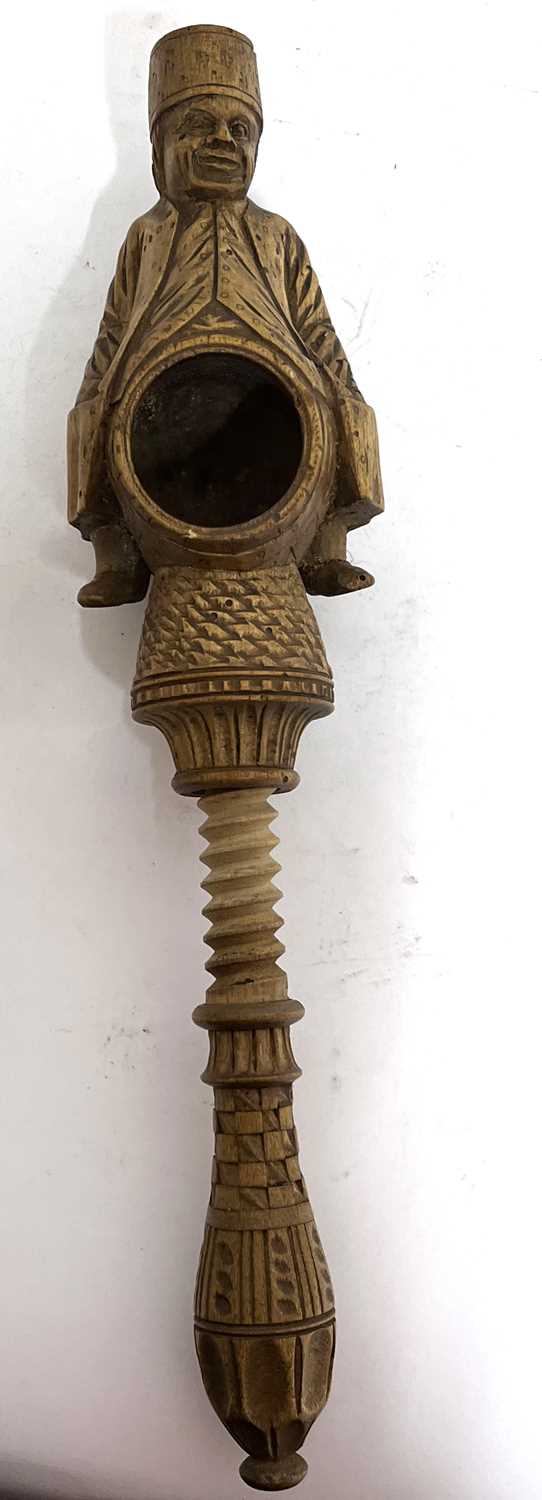 An antique treen box wood nut cracker, a carved figure sitting astride a barrel with screw handle, - Image 6 of 8