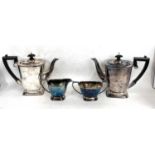 A Queen Elizabeth II four piece silver tea service comprising tea and coffee pot having ebonised