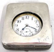 A Goliath pocket watch in a silver display case, the pocket watch is manually crown wound and the