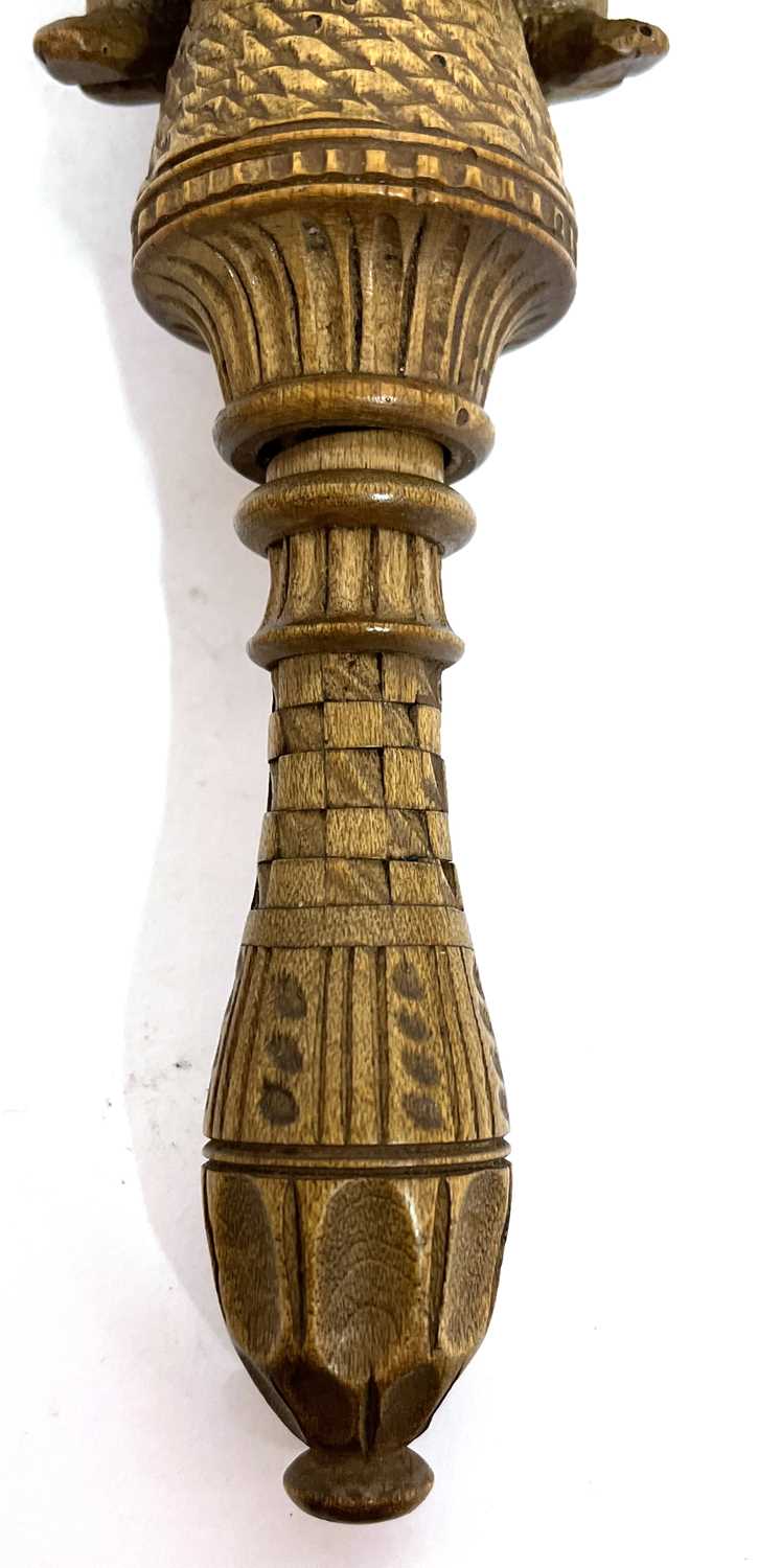 An antique treen box wood nut cracker, a carved figure sitting astride a barrel with screw handle, - Image 2 of 8