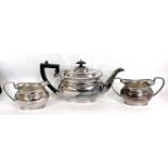 Hallmarked silver three piece tea service comprising teapot, sugar bowl and cream jug, Sheffield