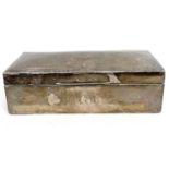 A hallmarked silver table cigarette box of rectangular form, the slightly domed hinged lid