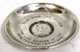 A small silver dish with coin inset centering a 1900 one shilling coin, engraved around with "God