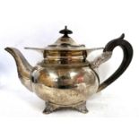 A George V silver teapot of globular form applied with shell and gadrooned border, an acanthus