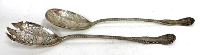 Pair of Edwardian silver salad servers, the bowls engraved and chased with foliate design,