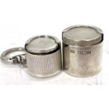 A hallmarked silver coin holder of drum shape, plain polished form, Birmingham 1985, makers mark for
