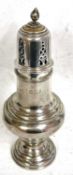 A Victorian silver caster of baluster form with pull off pierced lid and bud finial, on a raised