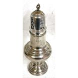 A Victorian silver caster of baluster form with pull off pierced lid and bud finial, on a raised