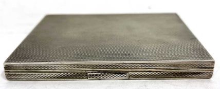 A Czechoslovakian silver cigarette case of rectangular form with overall engine turned decoration
