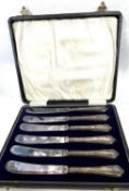 Cased set of six silver handled butter knives, hallmarked for Sheffield 1930, makers mark John