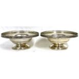 A pair of George VI silver pedestal dishes of circular squat form with applied pierced edges,